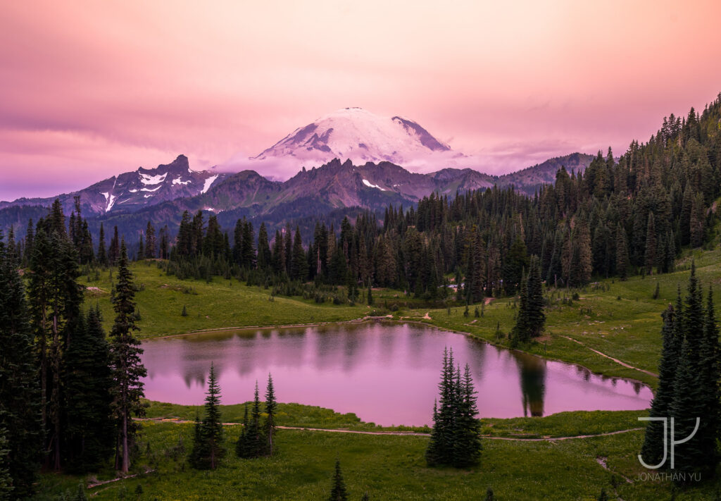 Tranquil sunset at Tipsoo Lake as forest fires bring thick waves of smoke